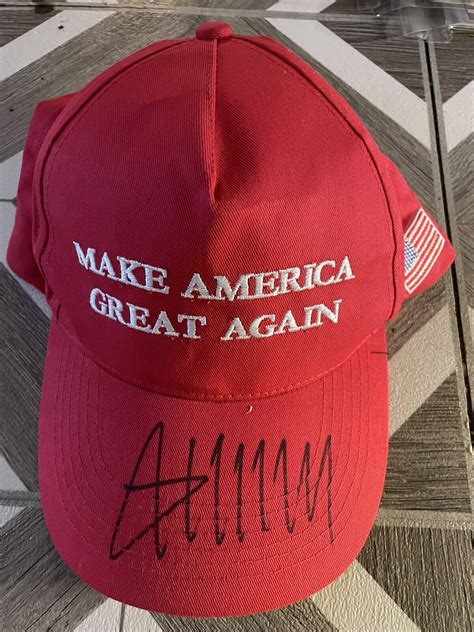 donald trump signed maga hat.